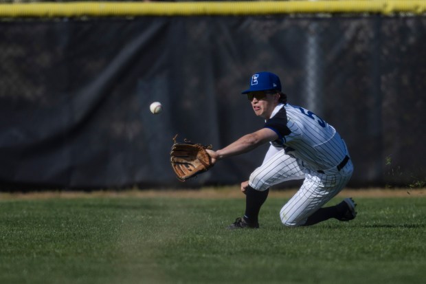 Lincoln-Way East's MJ Schley (5) dives for a ball in centerfield during a South West Suburban Conference game against Lockport in Frankfort on Thursday, April 25, 2024. (Vincent D. Johnson/for the Daily Southtown)
