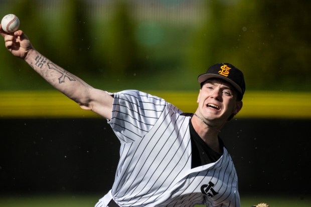 St. Laurence's Declan Musil delivers a pitch against Providence during a Chicago Catholic League Blue game in Burbank on Tuesday, April 23, 2024. (Vincent D. Johnson/for the Daily Southtown)