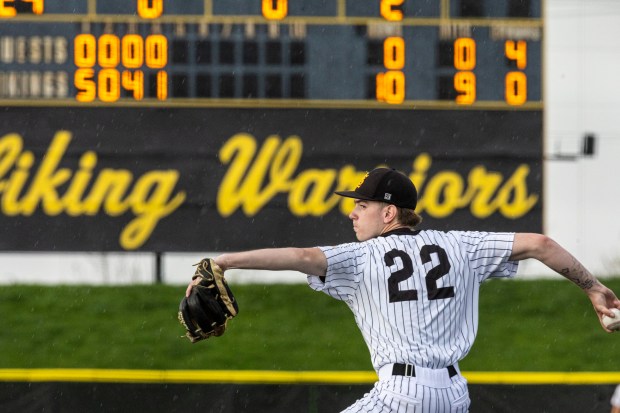 With two outs and a 10-0 lead, St. Laurence's Declan Musil winds up as he attempts to throw a five-inning no hitter against St. Rita during a Chicago Catholic League Blue game in Burbank on Tuesday, April 16, 2024. (Vincent D. Johnson/for the Daily Southtown)