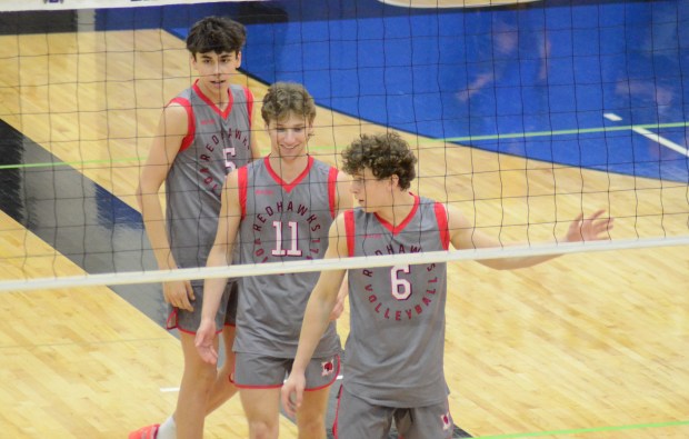 Marist's Ethan Kuziela, Luke Brannigan and Griffin McElroy, from left, prepare for a play against Glenbard West in the championship match of the Lincoln-Way East Invitational in Frankfort on Saturday, April 27, 2024. (Jeff Vorva / Daily Southtown)