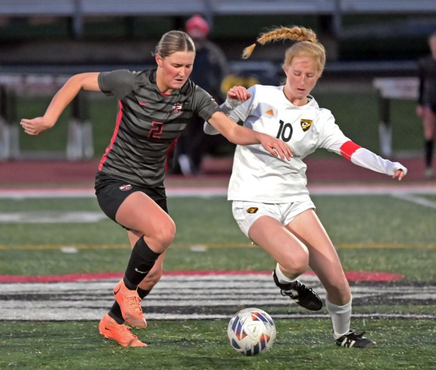 Andrew's Bella Kreydich battles for the ball with Lincoln-Way Central's Madi Watt. Andrew defeated Lincoln-Way Central in girls soccer, Friday, April 19, 2024, in New Lenox, Illinois. (Jon Langham/for the Daily Southtown)
