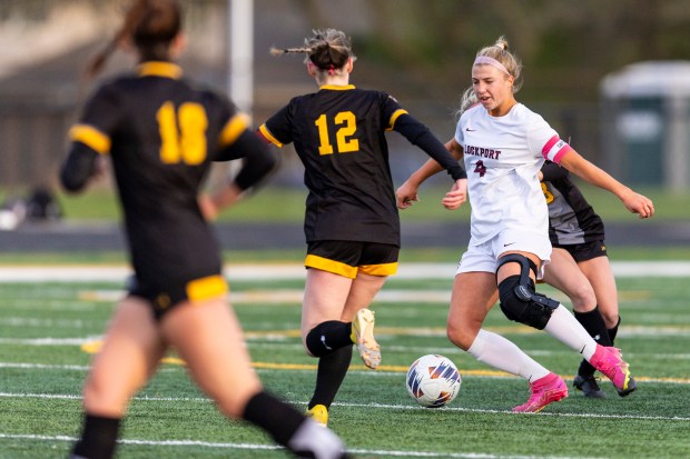 Lockport's Brinlee McNabb (4) works on clearing a ball from the Porters' zone during a South West Suburban Conference game against Andrew in Tinley Park on Monday, April 2, 2024. (Vincent D. Johnson/for the Daily Southtown)