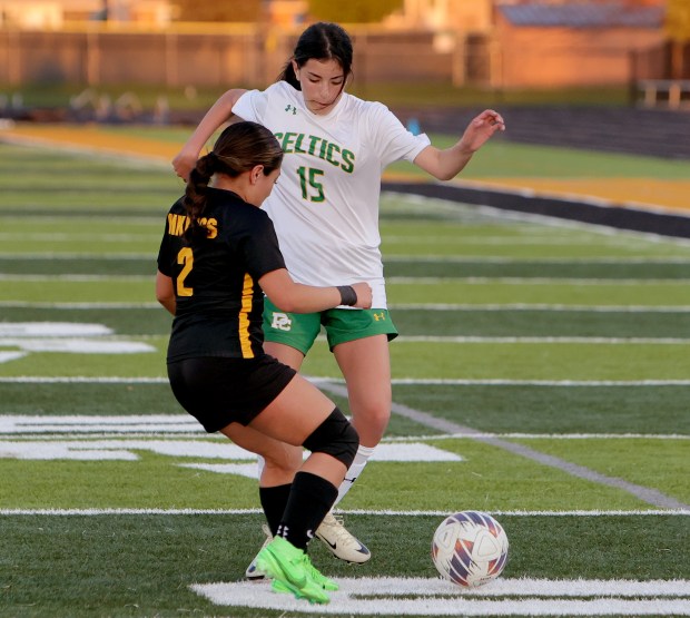 Providence's Giuliana Savarino, right, and St. Laurence's Nataly Velasco, left, battle for the ball during the soccer game in Burbank Monday, April 8, 2024. (James C. Svehla/for the Daily Southtown)