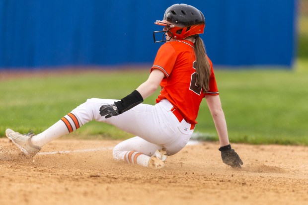 Shepard's Abbie Statham-Ball slides safely into third base after running a wild pitch during a South Suburban Red game against Reavis in Burbank on Monday, April 29, 2024. (Vincent D. Johnson/for the Daily Southtown)