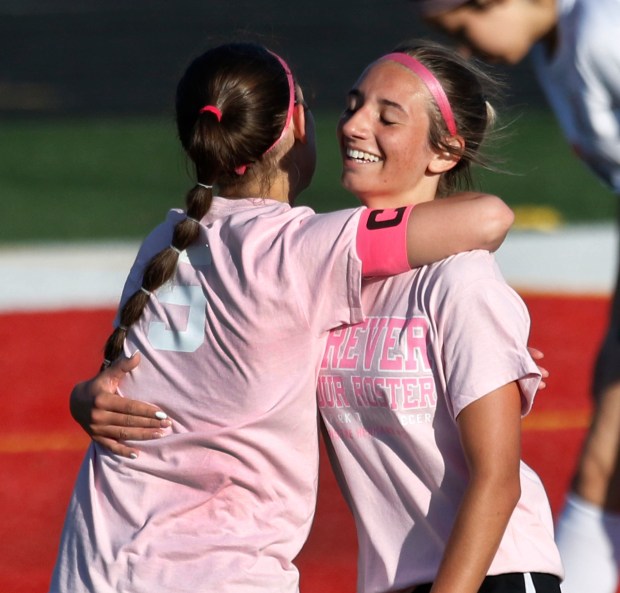 Tinley Park's Gianna Butler (left) gets congratulated by teammate Addie Weed (right) after Butler scored against T. F. United during a soccer game on Thursday, April 25, 2024. (John Smierciak/for the Daily Southtown)