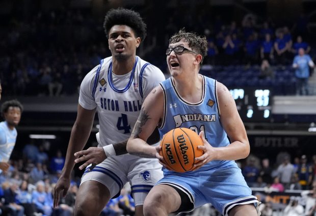Indiana State center Robbie Avila drives to the basket past Seton Hall center Elijah Hutchins-Everett (4) during the second half of an NCAA college basketball game for the championship of the NIT, Thursday, April 4, 2024, in Indianapolis. (AP Photo/Michael Conroy)