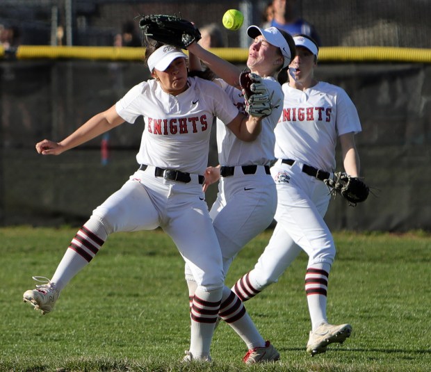 Lincoln-Way Central's Alexis Younger and Kendall Pearson collide during the softball game against Lincoln-Way East in Frankfort Monday, April 8, 2024. (James C. Svehla/for the Daily Southtown)