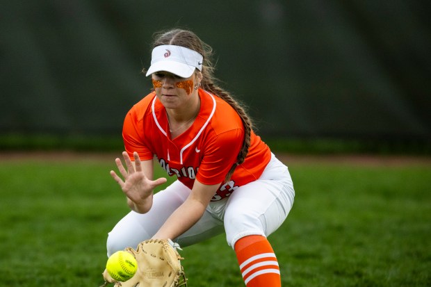 Lincoln-Way West's Reese Cusack controls a bouncing hit to right field during a South West Suburban Conference game against Lincoln-Way East in Frankfort on Thursday, April 18, 2024. (Vincent D. Johnson/for the Daily Southtown)