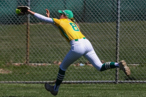 Providence's Lauren Gade (8) stretches out to catch a deep fly ball during a game against St. Laurence in New Lenox on Saturday, April 6, 2024. (Troy Stolt/for the Daily Southtown)