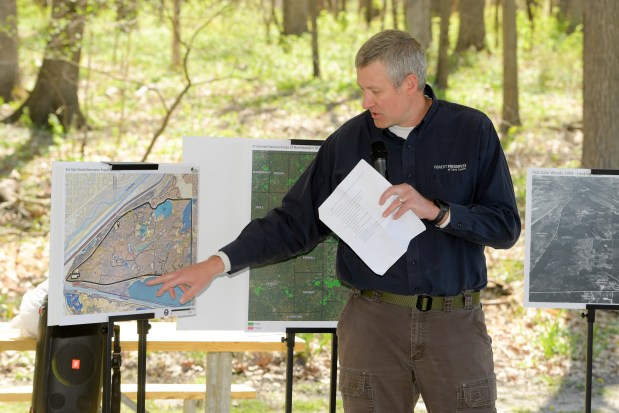 Troy Showerman, resource project manager for the Forest Preserves of Cook County, speaks April 25 about the scope of a $10 million restoration project underway in the Palos Preserves during a presentation at Red Gate Woods in Willowbrook. (Mark Black / Daily Southtown)