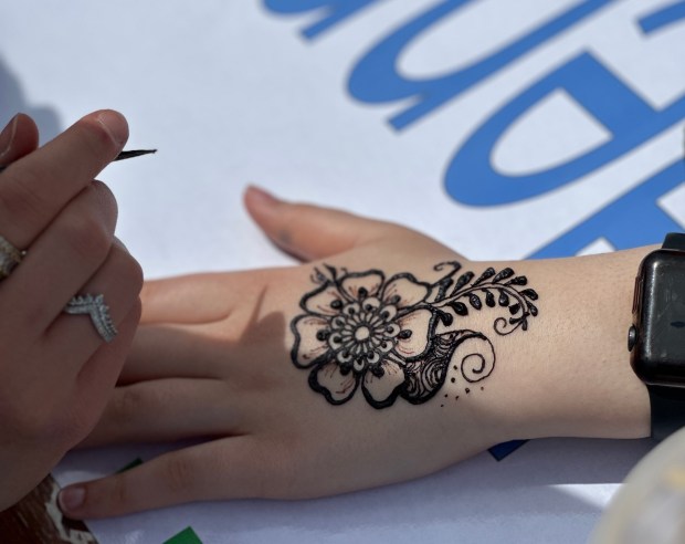 A vendor creates intricate patterns with henna during last year's observance of Arab Heritage Month at Stagg High School in Palos Hills. (Suzan Atallah)