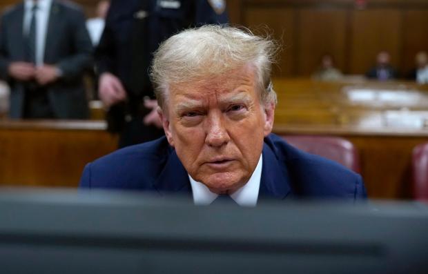 Former President Donald Trump awaits the start of proceedings during jury selection at Manhattan criminal court, Thursday, April 18, 2024 in New York. (Timothy A. Clary/Pool Photo via AP)