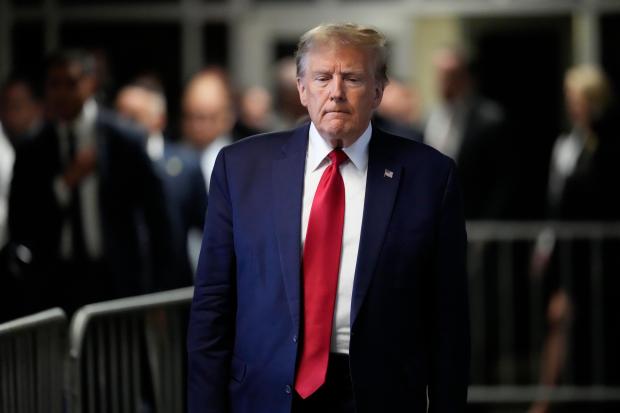 FILE - Former President Donald Trump leaves Manhattan criminal court, Thursday, Feb. 15, 2024, in New York. The hush money trial of former President Donald Trump begins Monday, April 15, with jury selection. It's a singular moment for American history as the first criminal trial of a former U.S. commander-in-chief. It's also the first of Trump's four indictments to go to trial. Trump is the presumptive Republican presidential nominee for November's election. (AP Photo/Mary Altaffer, File)