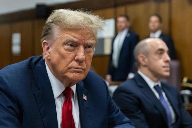 FILE - Former President Donald Trump attends jury selection at Manhattan criminal court in New York, April 15, 2024. Trump's criminal hush money trial involves allegations that he falsified his company's records to hide the true nature of payments to his former lawyer Michael Cohen, who helped bury negative stories about him during the 2016 presidential campaign. He's pleaded not guilty. (Jeenah Moon/Pool Photo via AP, File)