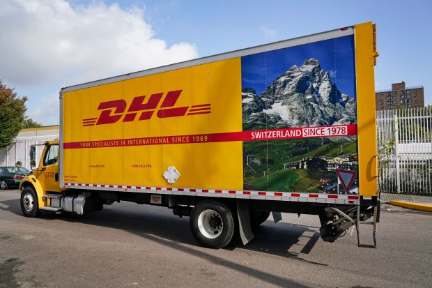 A DHL delivery truck passes a DHL location on Oct. 20, 2020, in New York. (Frank Franklin II/AP Photo)
