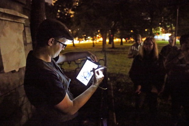 Adam Selzer, a local historian, leads a group on a tour of Lincoln Park to talk about the history of grave robbing in Chicago, Aug. 30, 2016. (Nuccio DiNuzzo/Chicago Tribune)