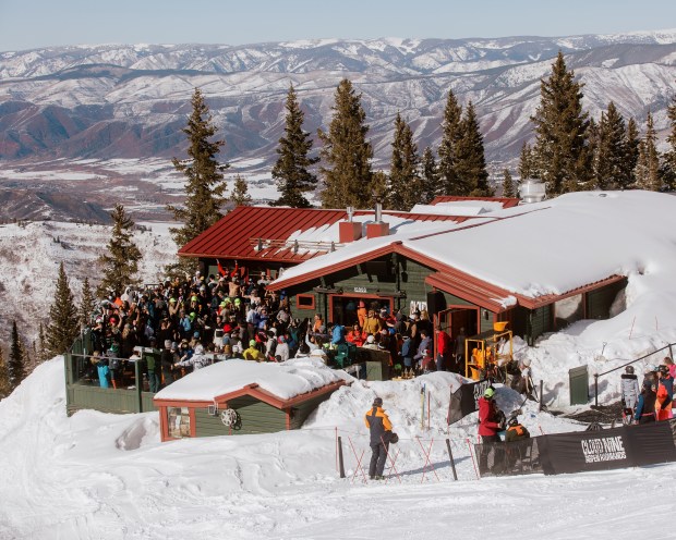 Patrons at Cloud Nine Alpine Bistro, on the slopes of Aspen Highlands, in Aspen, Colorado, March 9, 2024. Cloud Nine Alpine Bistro is a favorite place for afternoon dancing and revelry -- and for spraying Champagne on fellow patrons. (Matthew DeFeo/The New York Times)