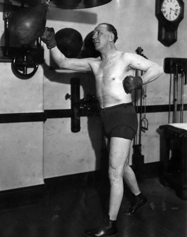 Judge John H. Lyle uses a punching bag in a gym at 105 W. Monroe Street in Chicago on Jan. 29, 1931. Lyle keeps trim while he campaigns for mayor of the city. (Chicago Tribune historical photo) 