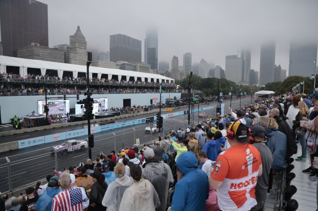 Fans watch Stage 1 of the NASCAR Cup Series race at Grant Park on July 2, 2023, in Chicago. (Antonio Perez/Chicago Tribune)