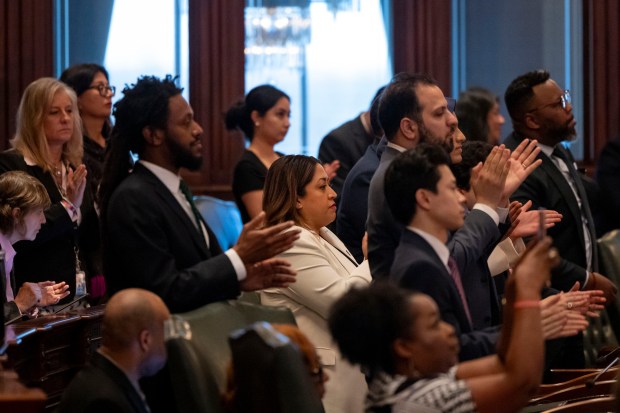 Democratic lawmakers applaud as Gov. J.B. Pritzker delivers his State of the State and budget address before the General Assembly at the Illinois State Capitol, Feb. 21, 2024. (Brian Cassella/Chicago Tribune)