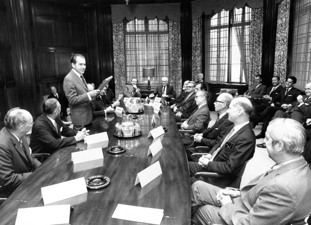 President Nixon meets with the editorial board of the Chicago Tribune and Chicago Today on Sept. 17, 1970. Nixon is holding an editorial cartoon which appeared in the Sept. 16 issues of the Tribune. (Don Casper/Chicago Tribune)