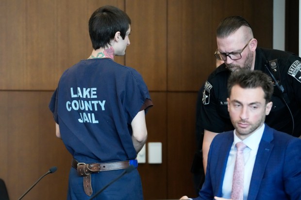 Robert E. Crimo III, left, leaves after a case management meeting with Judge Victoria A. Rossetti at the Lake County Courthouse Wednesday, April 24, 2024, in Waukegan, Ill. Crimo III is charged with killing seven people and wounding dozens more in a shooting at an Independence Day parade in the suburban Chicago town of Highland Park, Ill. (AP Photo/Nam Y. Huh, Pool)