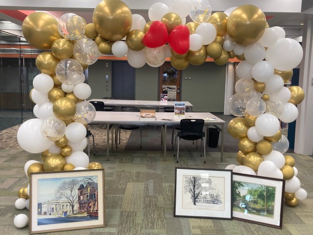 A balloon arch with pictures around it showing the Waukegan Public Library's history was part of its 125th anniversary gala. (Steve Sadin/Lake County News-Sun)