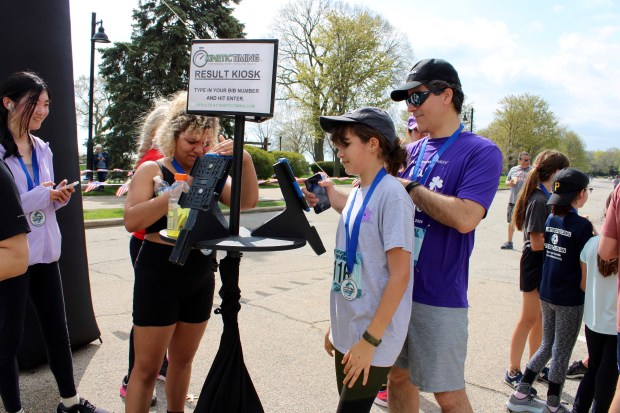 The Lakeshore Shuffle Result Kiosk gave participants a chance to check their finish time and ranking in the race. Credit: Gina Grillo.