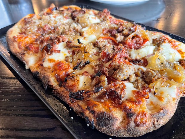 "The Fatty" flatbread at Fatpour Tap Works with pepperoni, bacon, IPA onions, fresh and shredded mozzarella, provolone and red sauce. Credit: Richard Requena