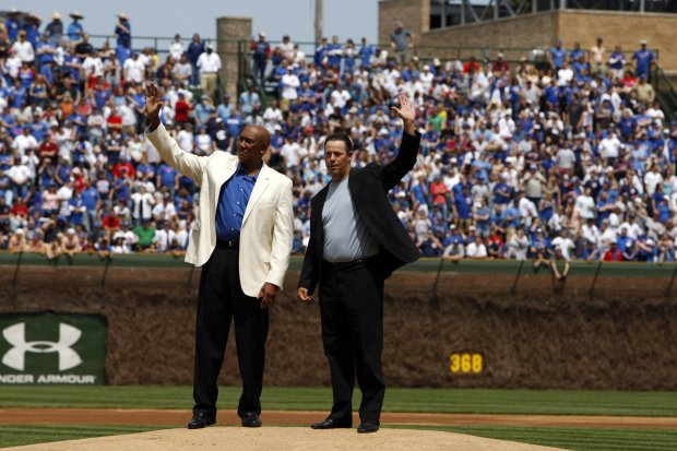 Cubs greats Ferguson Jenkins and Greg Maddux during a ceremony retiring their No. 31 at Wrigley Field on May 3, 2009. (Scott Strazzante/Chicago Tribune)