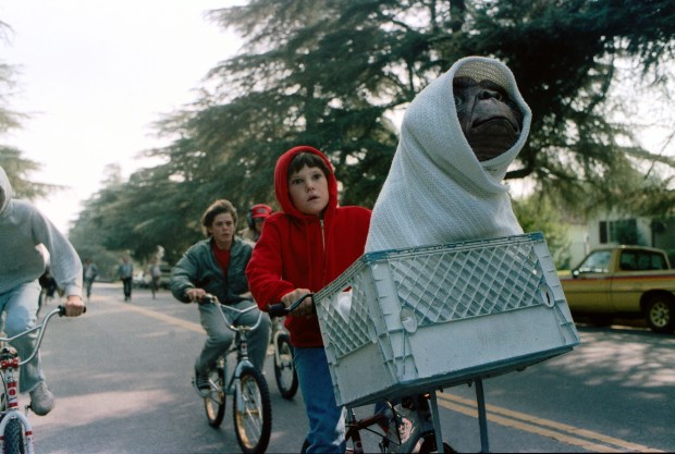 Henry Thomas as Elliott and E.T. in a basket on a bicycle in a scene from director Steven Spielberg's 1982 movie "E.T.: The Extra-Terrestrial."