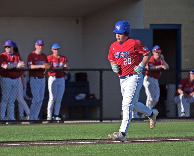 Marmion's Ethan Flores is sent home from third after the third baseman was called for interference in the base path. Marmion defeated Aurora Central Catholic, 5-2 in baseball, Tuesday, April 30, 2024, in Aurora, Illinois. (Jon Langham/for the Beacon-News)