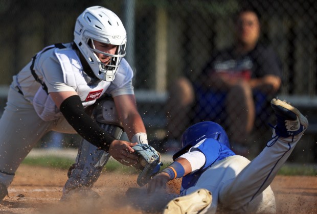 Streamwood's Austin Paskewic (22) puts the tag on Larkin's Moises Acosta (13) for an out in the fifth inning during an Upstate Eight conference game in Streamwood on Monday, May 6, 2024. Streamwood won, 9-5.H. Rick Bamman / For the Beacon-News