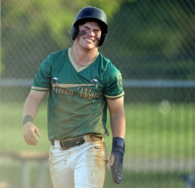 St Edward's Jack Cozzi grimaces after scoring a run in the first inning during a Chicagoland Christian Conference game against Marian Central on Wednesday, May 1, 2024 at Wing Park in ElginH. Rick Bamman / For the Beacon News