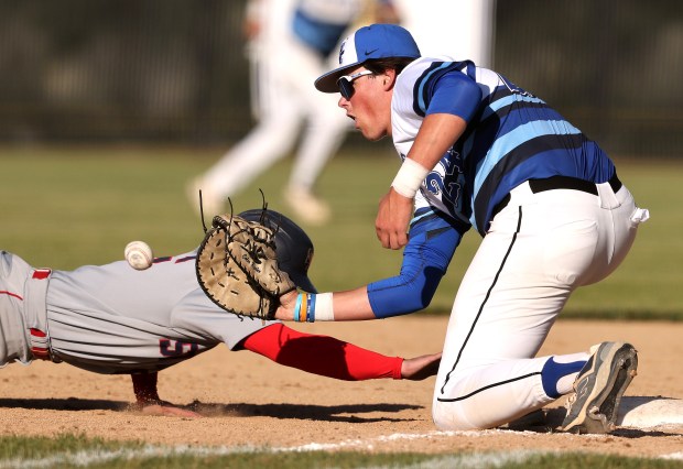 St. Charles North's Colin Ryder (24) waits for a pick-off attempt from pitcher Joshua Caccia (1) against South Elgin's Dominic Conidi (5) during a Class 4A St. Charles North Sectional semifinal game on Wednesday, May 29, 2024 in St. Charles. St. Charles North won, 3-2.H. Rick Bamman / For the Beacon News