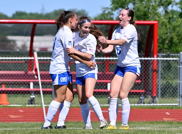 St. Charles North players from left, Laney Stark, Megan Hines and Ryan Spaulding celebrate Hines' goal during the IHSA Class 3A South Elgin Sectional Girls Soccer Final at South Elgin High School in South Elgin, Saturday, May 25, 2024.(Michael Schmidt/For The Aurora Beacon-News) ABN-L-GSO-SOELG-SECT-0526