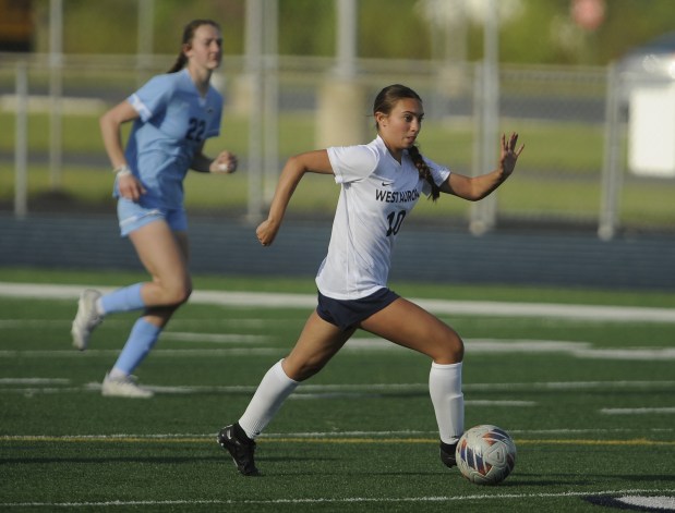 West Aurora's Olivia Del Toro (10) works the ball up field against Plainfield South during a Southwest Prairie Conference game Tuesday, April 30, 2024 in Plainfield, IL. (Steve Johnston/The Beacon-News)