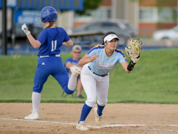 ACC's Natalie Sanchez (21) covers first for the out on Geneva's Kathleen Cerwin (11) at home in Aurora on Tuesday, May 7, 2024. (Mark Black / for the Beacon-News)
