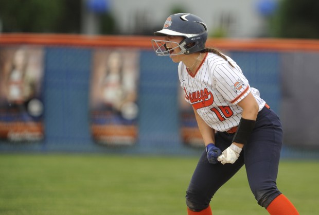 Oswego's Rikka Ludvigson (16) looks towards her dugout and lets out a scream after RBI double giving the Panthers a 5-1 lead against Yorkville during the Class 4A Oswego Regional final Friday, May 24, 2024 in Oswego, IL. (Steve Johnston/The Beacon-News)