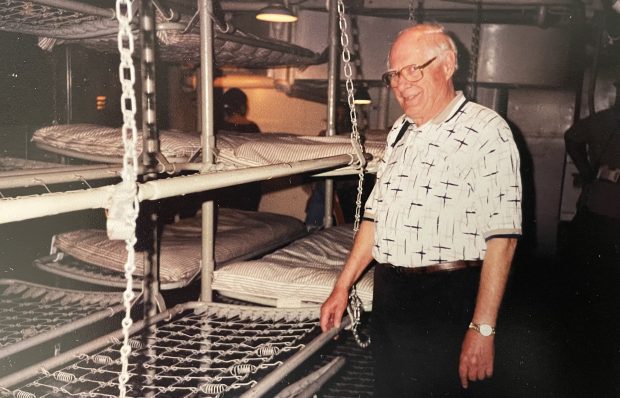 During a 2002 visit to the USS Texas, now a museum, Navy veteran Bob Larson stands in front of what was once his bunk on board the battleship that served in numerous invasions during World War II, including D-Day (Robert E. Larson)