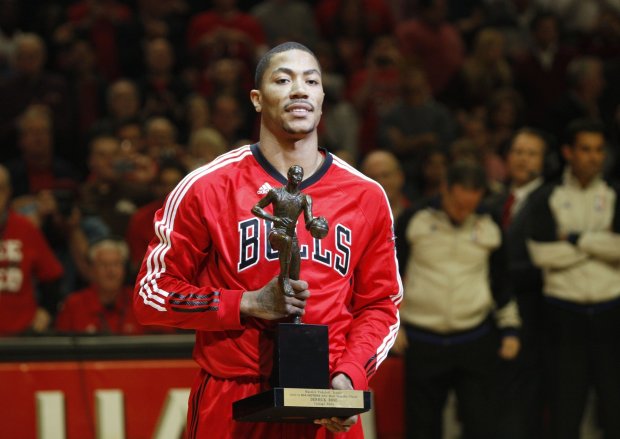 Derrick Rose accepts the NBA MVP award from commissioner David Stern in 2011.