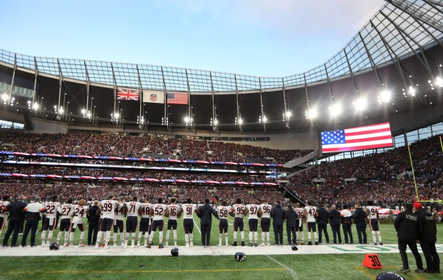 The Bears stand for the national anthem before a game against the Raiders at Tottenham Hotspur Stadium in London on Oct. 6, 2019. (Chris Sweda / Chicago Tribune)