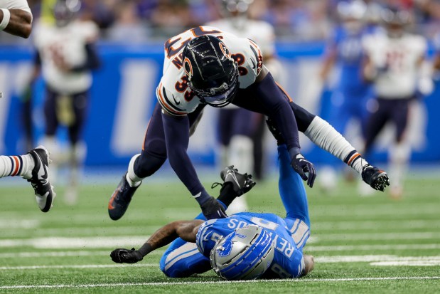 Chicago Bears cornerback Jaylon Johnson jumps over Detroit Lions wide receiver Josh Reynolds after guarding him while also getting a pass interference call during the second quarter at Ford Field Nov. 19, 2023 in Detroit. (Armando L. Sanchez/Chicago Tribune)