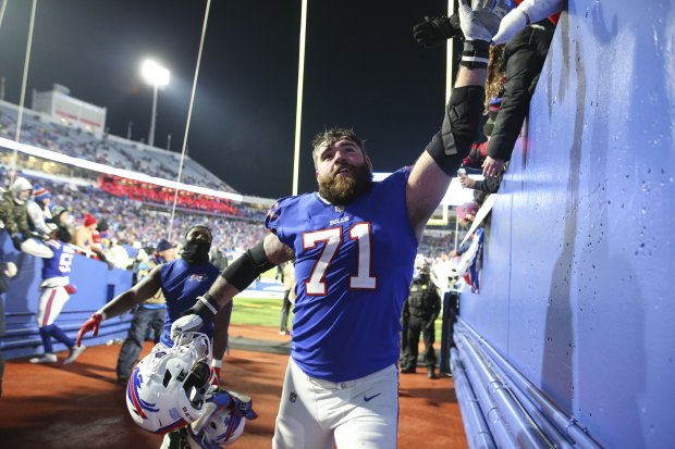 The Bills' Ryan Bates celebrates with fans after a game against the Jets on Jan. 9, 2022, in Orchard Park, N.Y. (AP Photo/Joshua Bessex)