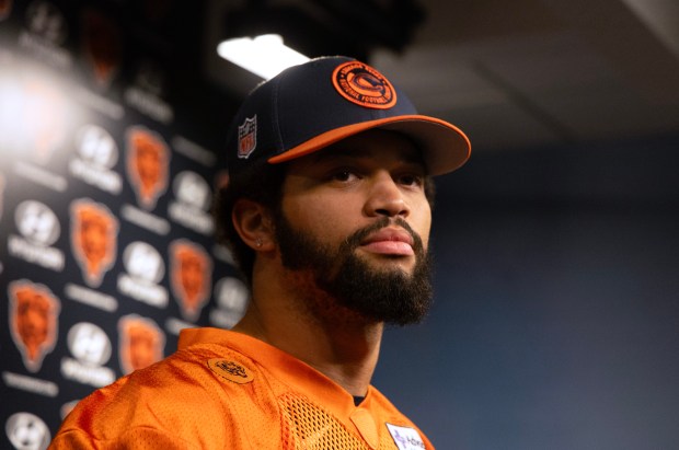 Chicago Bears quarterback Caleb Williams (18) speaks with the media before the start of Chicago Bears rookie minicamp at Halas Hall on May 10, 2024, in Lake Forest. Top draft picks in 2024 include Caleb Williams, Rome Odunze, Kiran Amegadjie, Tory Taylor and Austin Booker plus undrafted free agents (Stacey Wescott/Chicago Tribune)