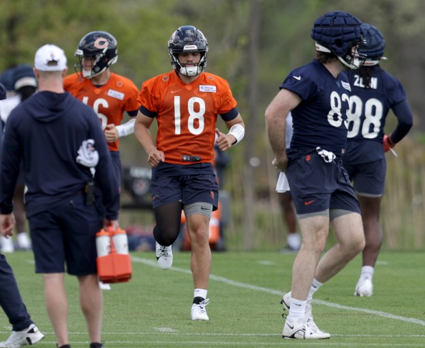 Bears quarterback Caleb Williams (18) warms up during rookie minicamp at Halas Hall on May 10, 2024, in Lake Forest. (Stacey Wescott/Chicago Tribune)