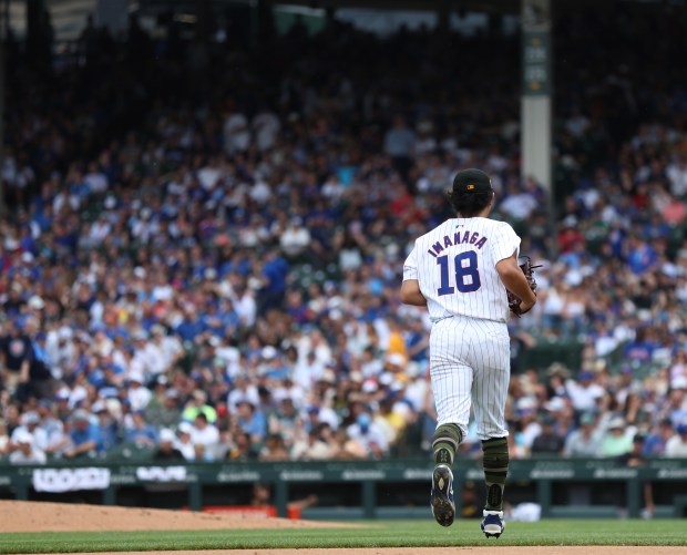 Chicago Cubs starting pitcher Shota Imanaga (18) runs out onto the field to start the seventh inning of a game against the Pittsburgh Pirates at Wrigley Field in Chicago on May 18, 2024. (Chris Sweda/Chicago Tribune)