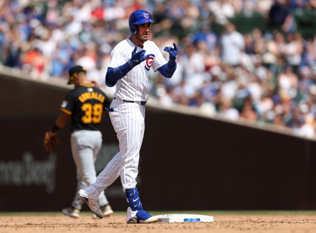 Chicago Cubs center fielder Cody Bellinger celebrates at second base after hitting a double in the ninth inning of a game against the Pittsburgh Pirates at Wrigley Field in Chicago on May 18, 2024. (Chris Sweda/Chicago Tribune)