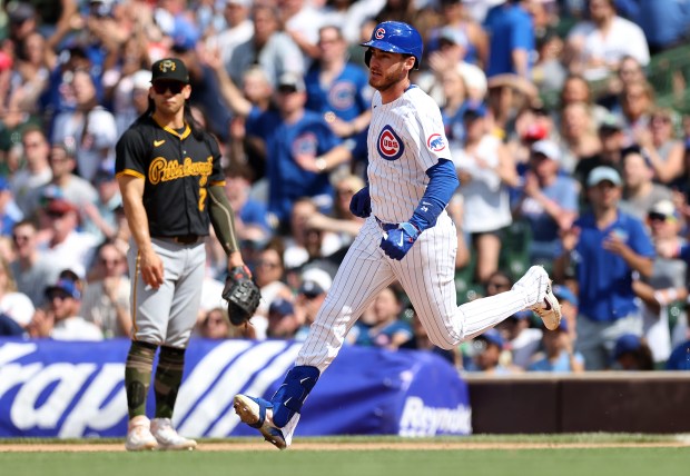 Chicago Cubs center fielder Cody Bellinger sprints to second base with a double in the ninth inning of a game against the Pittsburgh Pirates at Wrigley Field in Chicago on May 18, 2024. (Chris Sweda/Chicago Tribune)