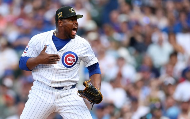 Cubs relief pitcher Héctor Neris (51) celebrates after closing out the Pittsburgh Pirates in the ninth inning at Wrigley Field on May 18, 2024. (Chris Sweda/Chicago Tribune)